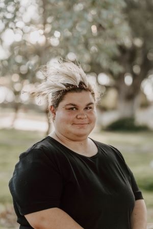 Angelica Hori poses for a portrait photo with her signature bright smile.