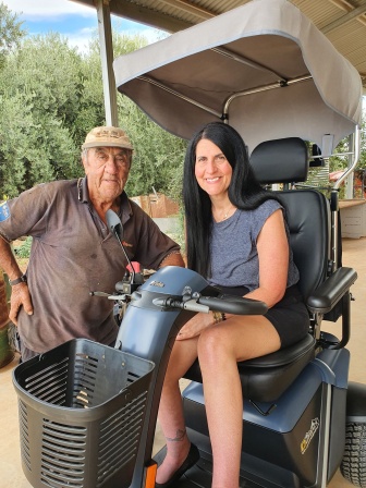 maria with her new scooter and pasquale