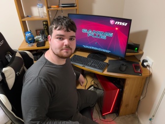 nicholas crawford in front of his computer 