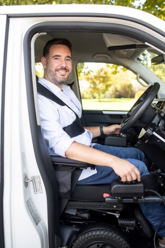 Santi Martinez smiling in his van 