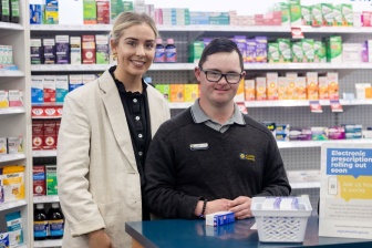 Patrick at the chemist with a colleague 
