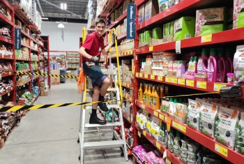 ian fraser at bunnings on a ladder with the section hes working in tape
