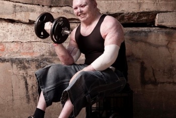 Dean Clifford doing weights with a smile