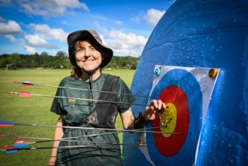Janelle Colquhoun with arrows on an archery board 