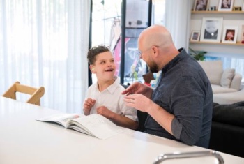 Greyson reading a book.