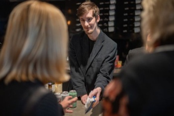 Jack serving customers in his employed role 